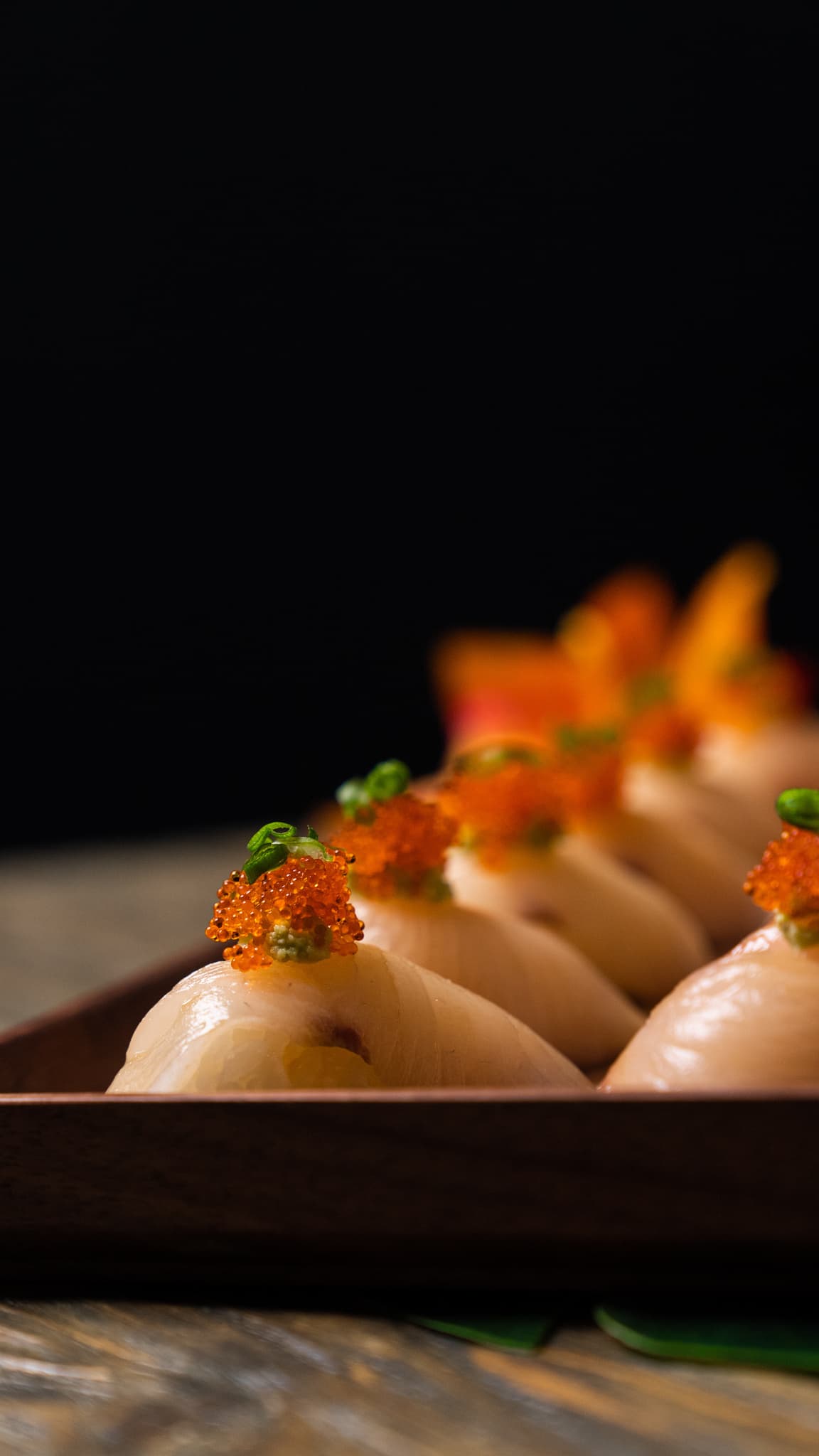 Exquisite nigiri topped with vibrant tobiko roe
